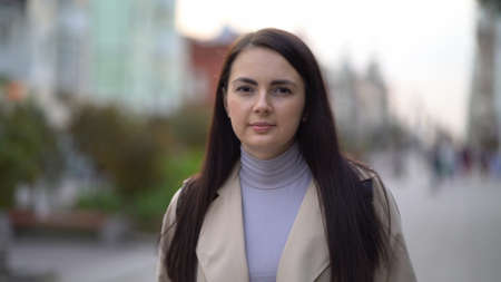 Portrait young attractive business woman walking at city center feel happy fashion girlの写真素材