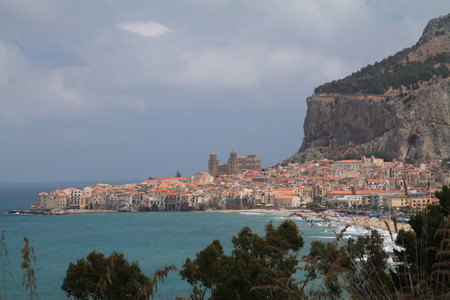 Sicilian village by the sea and under the mountain. Cefalu.の写真素材