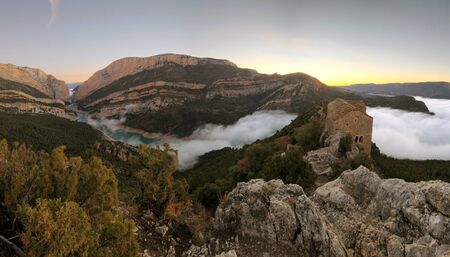 Roman hermitage over a sea of clouds, Hermitage of Santa Quiteria, in the Congost of Mont-rebei, Spainの写真素材