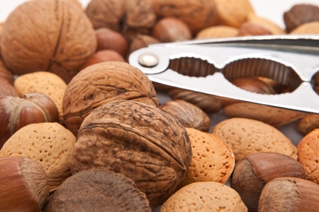 Close up of mixed nuts with a cracker