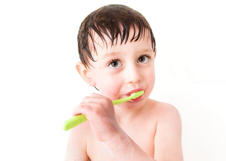little boy claning teethの写真素材