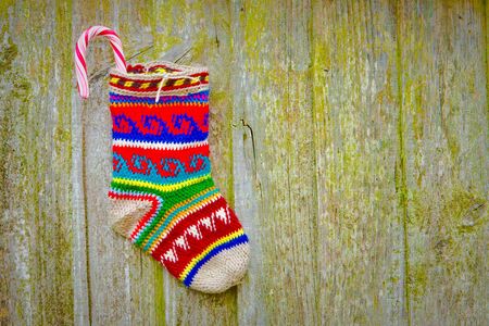An alternative christmas stocking with a candy caneの写真素材