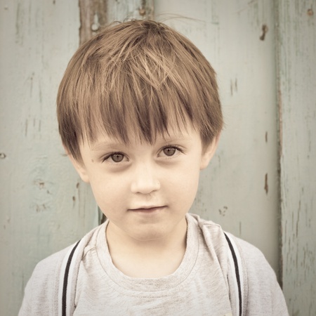 Adorable three year old boy in sepia tonesの写真素材