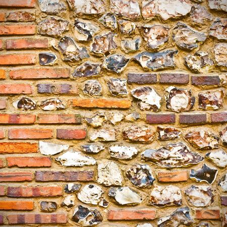 An interesting detailed sqaure background image of a flint and brick wallの写真素材