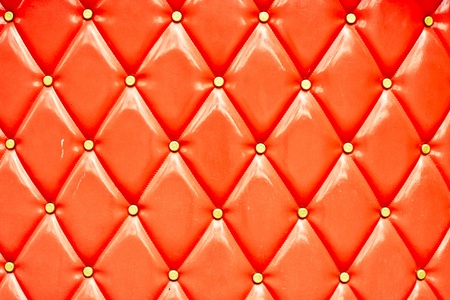 Vibrant retro style leather couch uoholstery as a backgroundの写真素材