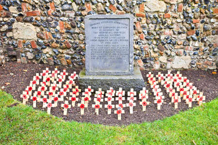 Bury St Edmunds, UK - NOVEMBER 5 2011: Poppy crosses are arranged in front of the Dunkirk Veterans association memorial stone in the Abbey Gardens, marking remembrance sunday on November 5, 2009 in Bury St Edmunds, UK.のeditorial素材