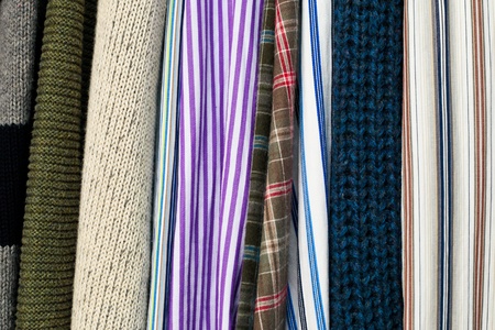 Close up of clothes hanging as a background imageの写真素材