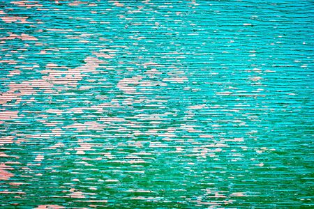 Weathered painted wood as a unique background imageの写真素材