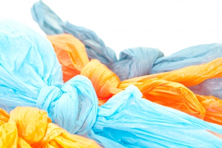 Tied up plastic bags on a white backgroundの写真素材