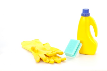Cleaning fluid and yellow goves on a white backgroundの写真素材