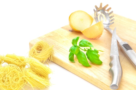 Fresh ingredients for an italian pasta meal on a white backgroundの写真素材