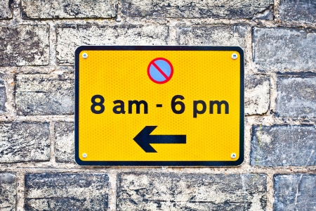 Sign indicating parking restrictions in an urban areaの写真素材