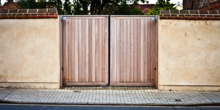 New wooden gate in a stone wallの写真素材