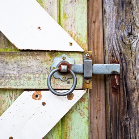 Close up of a lock on a wooden gateの写真素材