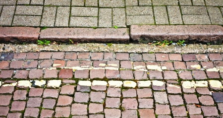An old cobbled road and pavement in a UK townの写真素材