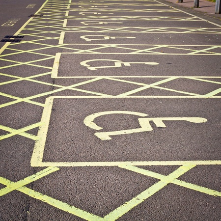 Row of empty disabled parking spaces in a parking lotの写真素材