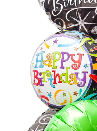 Colorful birthday balloons on a white backgroundの写真素材