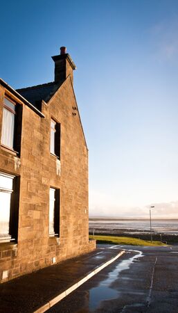 A seaside house in Burghead, Scotland in the winter sunshineの写真素材