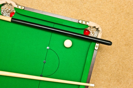 A small pool table on the floorの写真素材