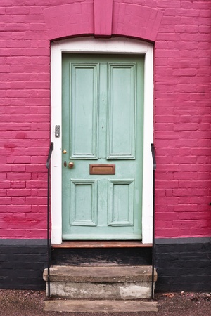 Green wooden front door of an english houseの写真素材