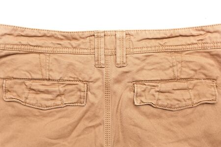 Man's trousers on white background showing rear pocketsの写真素材