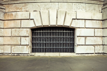 Bars in a wall in an old buildingの写真素材