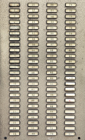 Intercom buttons for apartments in a city buildingの写真素材