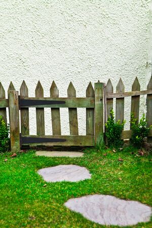 Picket fence and gate in a cottage gardenの写真素材