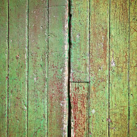 Weathered green painted wood as a backgroundの写真素材