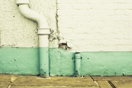 Drain pipes against a white wall as a backgroundの写真素材