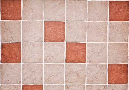 Orange and beige kitchen tiles as a backgroundの写真素材