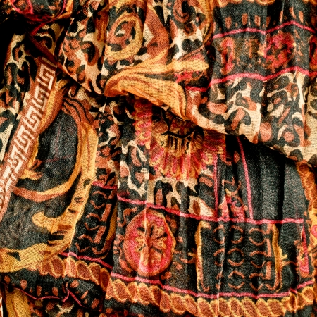 Close up of a colorful floral ethinic fabric as a background imageの写真素材