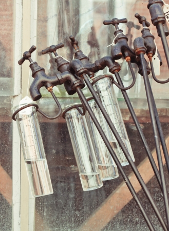 Ornamental garden rain measuring tubes on sale at a stallの写真素材