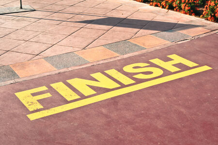 Finish point written on a racing track in yellow lettersの写真素材