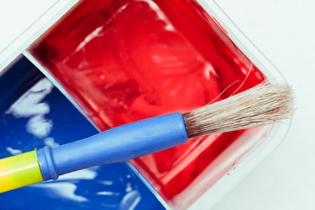 Close up of colorful paints with a paint brush headの写真素材