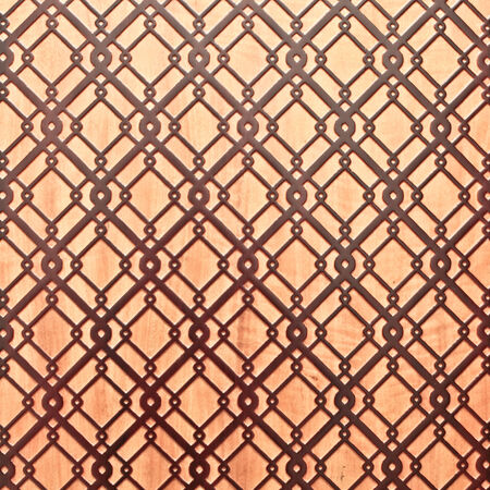 Geometric islamic pattern on a wooden surface as a backgroundの写真素材