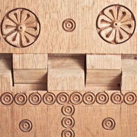 Close up of a carved wooden folding tableの写真素材