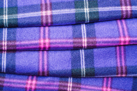 Close up of a folded tartan blanketの写真素材