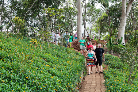 MAURITIUS â€“ NOVEMBER 21, 2013: Tourist groups walking along a path near the Chamarel...