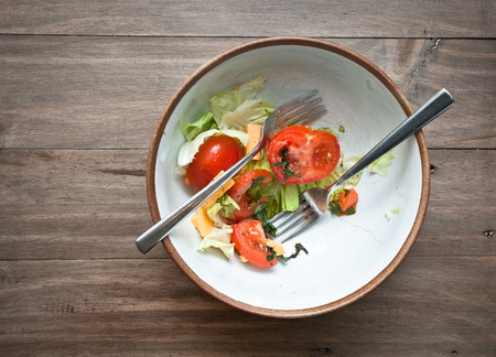 A half eaten fresh home meade saladの写真素材