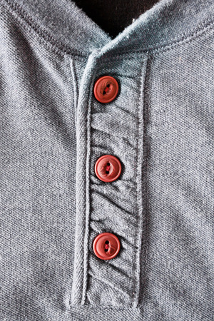 Close up of wooden buttons on a casual men's topの写真素材