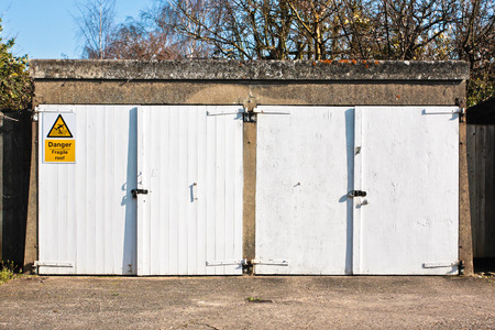 A pair of white wooden garage doorsの写真素材