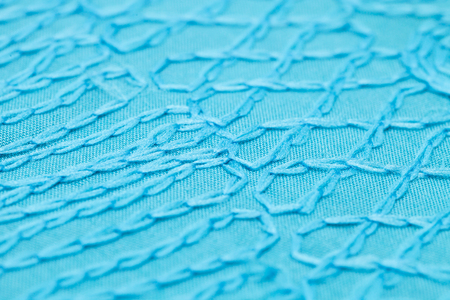 Detailed thread pattern on a blue topの写真素材