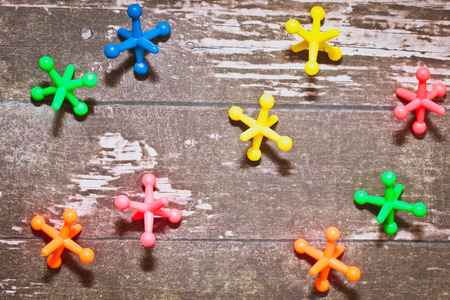 Colorful plastic toys on a wooden surfaceの写真素材