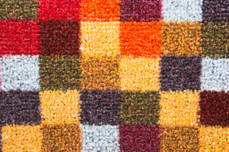 Colorful checked pattern on a carpet