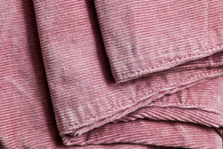 Close up of the seam on pink corduroy trousersの写真素材