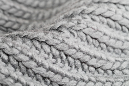 Close up of grey wool with detail of woven pattern