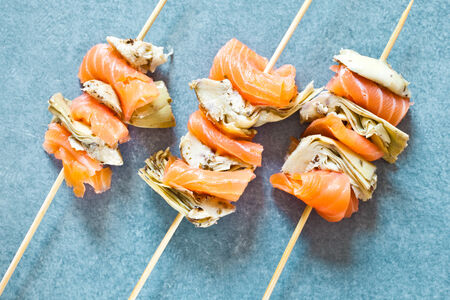 Smoked salmon and grilled artichoke kebabsの写真素材