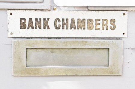 Letter box with sign saying bank chambersの写真素材