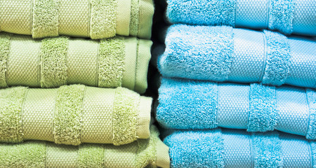 Stacks of blue and green towelsの写真素材